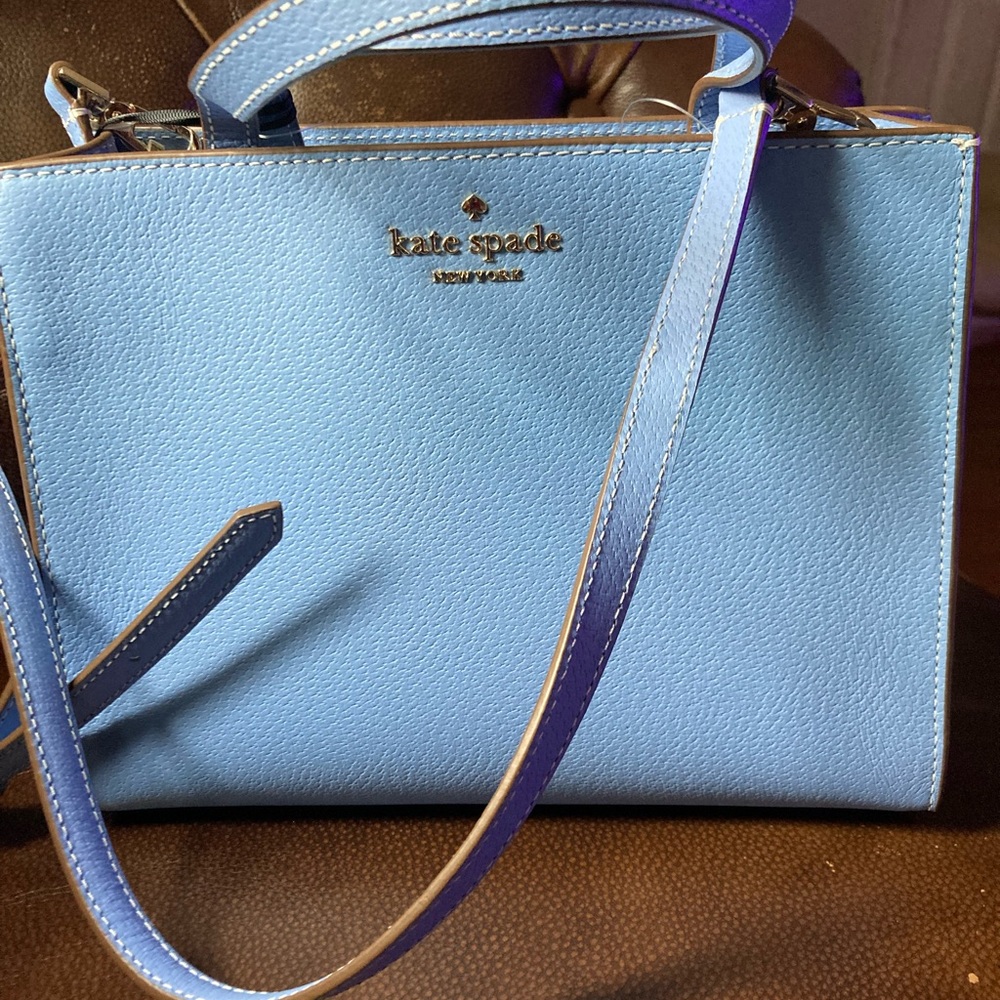 Brand new kade spade satchel bag. Never used. Comes with dust bag.